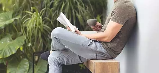 relaxing hipster man reading a book.